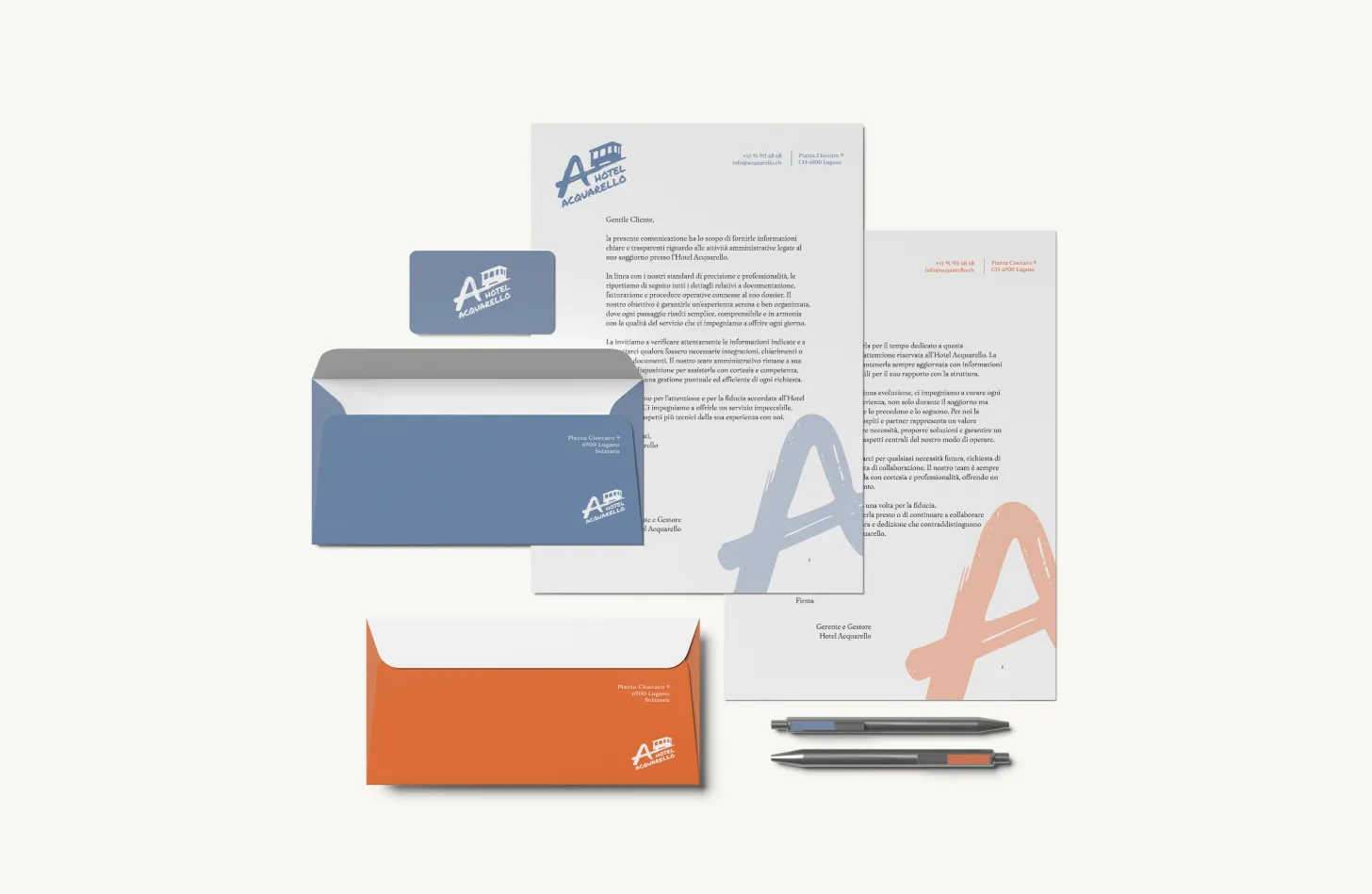 Hotel Acquarello, stationery completa: carta intestata, buste blu e arancio, penna e fogli con logo A e funicolare